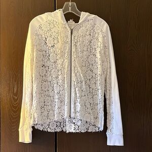Eze Sur Mer long sleeved white crocheted jacket with hood. Size Small